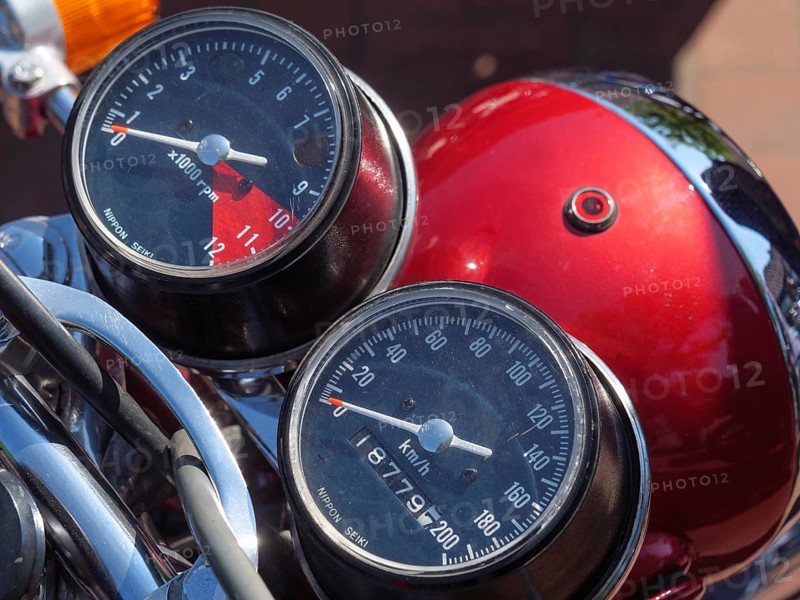 Motorbike displays with speedometer and rev counter, red tank in the background, Appelhülsen, münsterland, germany