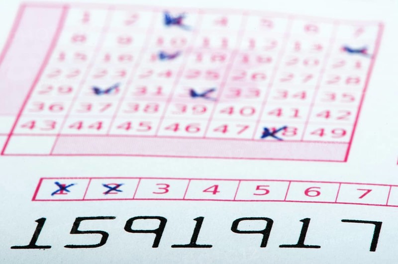 Marked lottery ticket close up. Studio shot