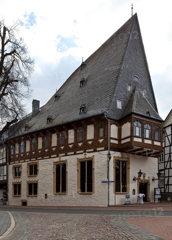 Goslar so called BRUSTTUCH 1521-26 Patrician house with slate gable today hotel 74988 above high massive basement Half-timbered upper floor with gabled bay window and relief carvings