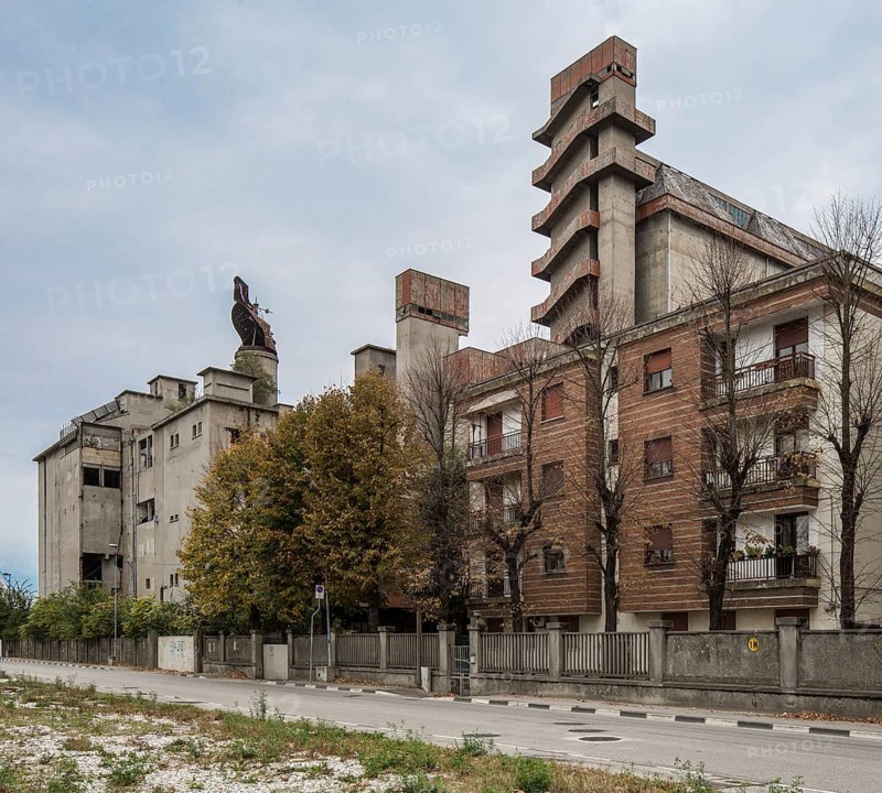 Porto Marghera near Venice, industrial harbour, malthouse and silo, residential building in front