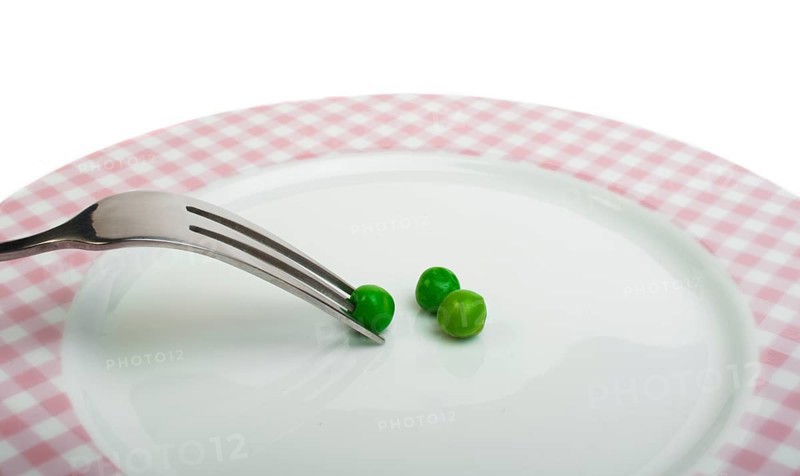 Plate with peas and centimeter measure