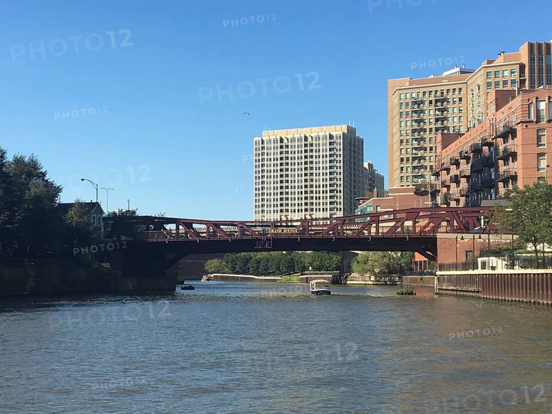 Urban environment with bridge and modern buildings along a river in sunshine, chicago, illinois, usa