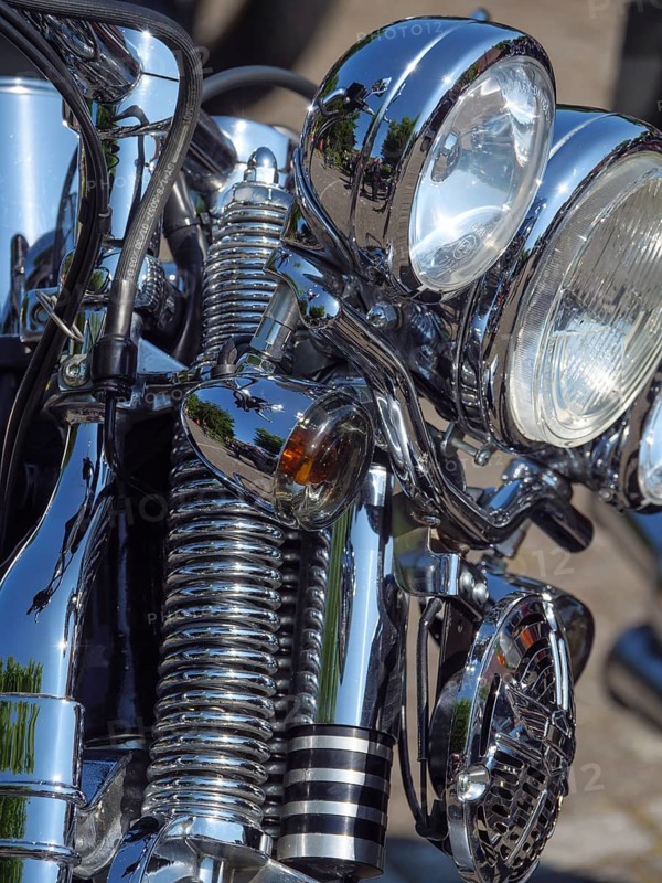 Detailed view of a chrome decorated motorbike with headlights and springs, Appelhülsen, münsterland, germany