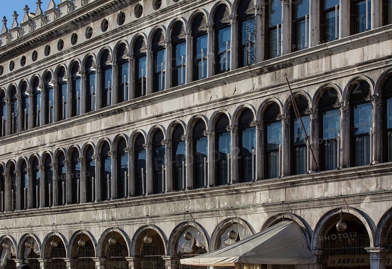 Italy Venice Old Procuratie -507 on the north side of St Mark's Square built in the early 16th century by Bartolomeo Bon Section of façade from the south-east
