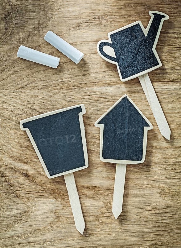 Composition of black wooden chalkboard price sign tags on wood board agriculture concept