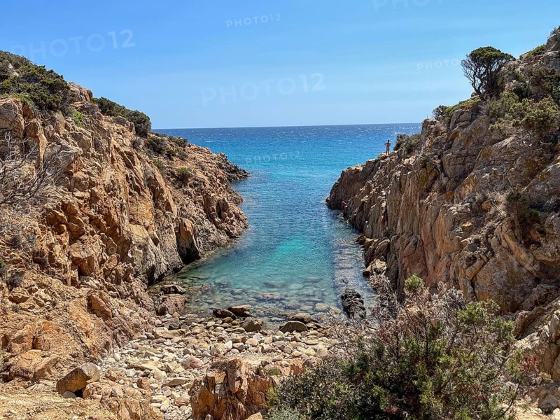 Narrow rock formation opens up to the turquoise-coloured sea, cagliari, sardinia, italy