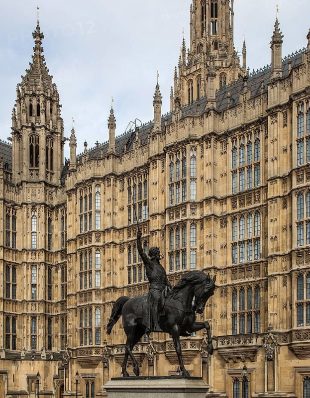 GB London 5625 Houses of Parliament west façade detail built 1840-70 by Charles Barry and Augustus Pugin in front of it equestrian statue of Richard the Lionheart 1856 by Carlo Marochetti