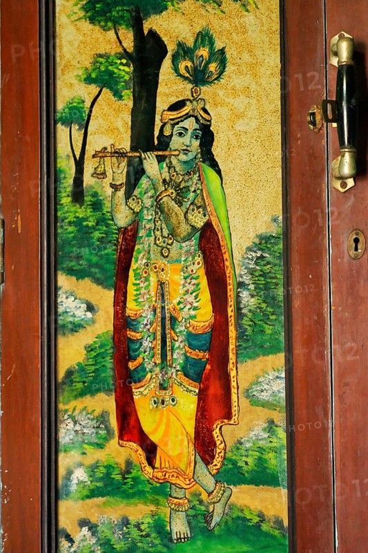 Heritage, glass painting of lord Krishna on door of wooden almira, Mota Devalia, district Amreli, Saurashtra