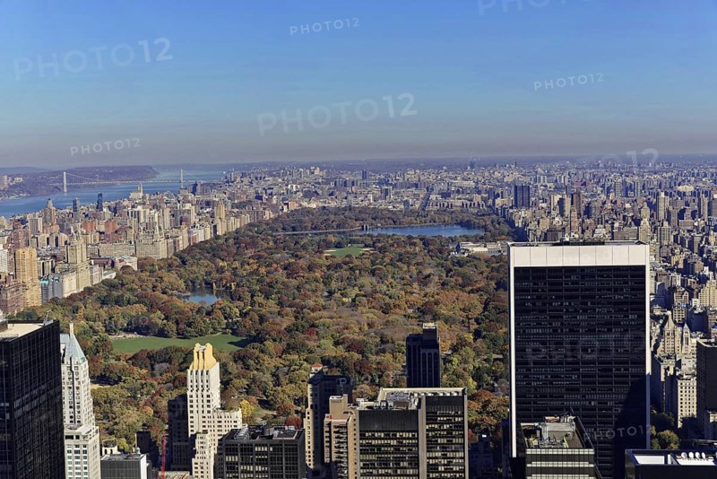 Rockefeller Center observation deck, view of skyscrapers in front of Central Park with autumn trees under a clear blue sky, Manhattan, New York City, New York, USA, North America, View over a large green park in the city with skyscrapers on the horizon, North America