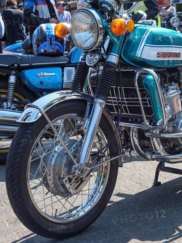 Retro Suzuki motorbike with silver and chrome-coloured elements on the road, Appelhülsen, münsterland, germany