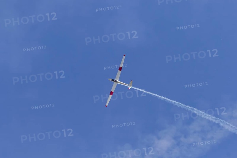 Airshow, glider with contrails against blue sky, Montreal, Province of Quebec, Canada, North America