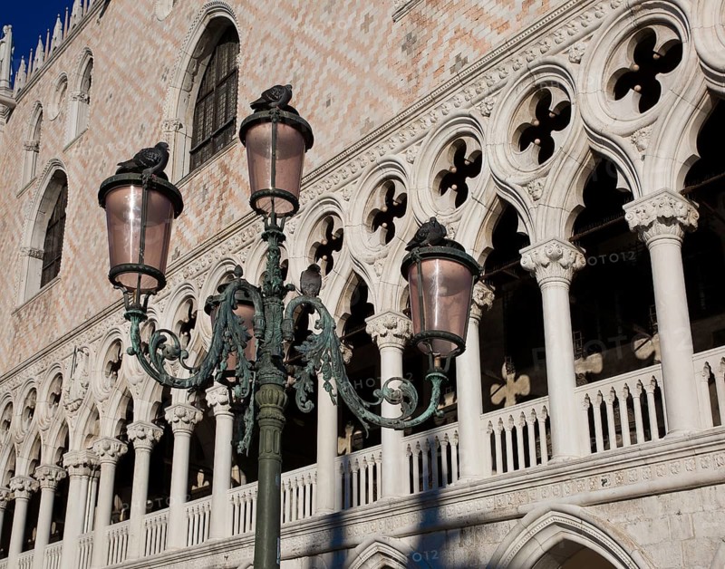 Italy Venice Doge's Palace -498 West façade 15th century with the loggia in the piano nobile structured by ogee arches and quatrefoils in the foreground candelabra