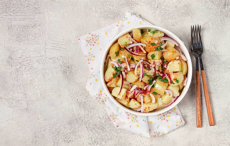 Boiled potato salad with red onion, German cuisine, homemade, no people