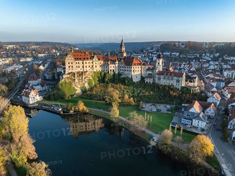 Aerial view of the town of Sigmaringen with the Hohenzollern Castle, a sight and tourist attraction above the old town and the Danube with autumnal vegetation, Danube valley, district of Sigmaringen, Baden-Württemberg, Germany, Europe