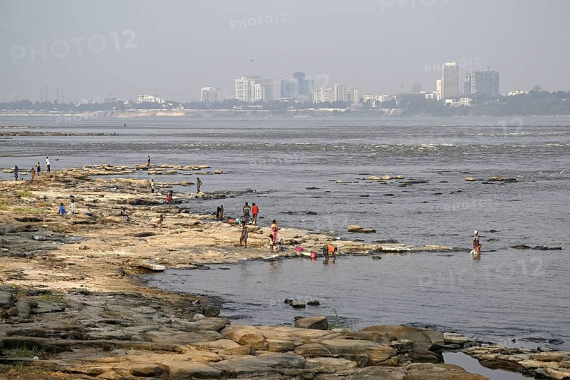 Women washing their laundry at the Congo River near the Malebo pool, formerly Stanley pool, Brazzaville, Republic of Congo