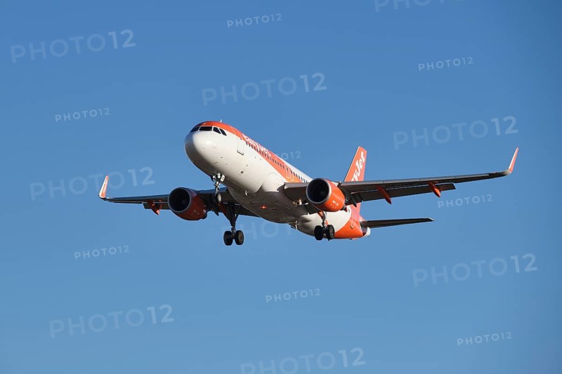 Lisbon, Portugal - September 2, 2023: easyJet Airbus A320-214 passenger plane descends to land in Humberto Delgado Airport in Lisbon