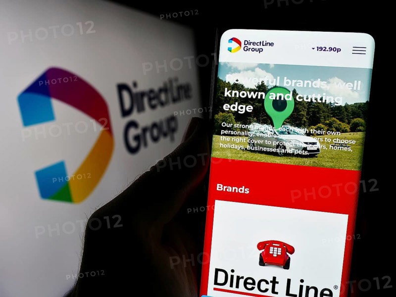 Stuttgart, Germany, 12-08-2023: Person holding smartphone with webpage of British financial company Direct Line Insurance Group plc with logo. Focus on center of phone display, Europe