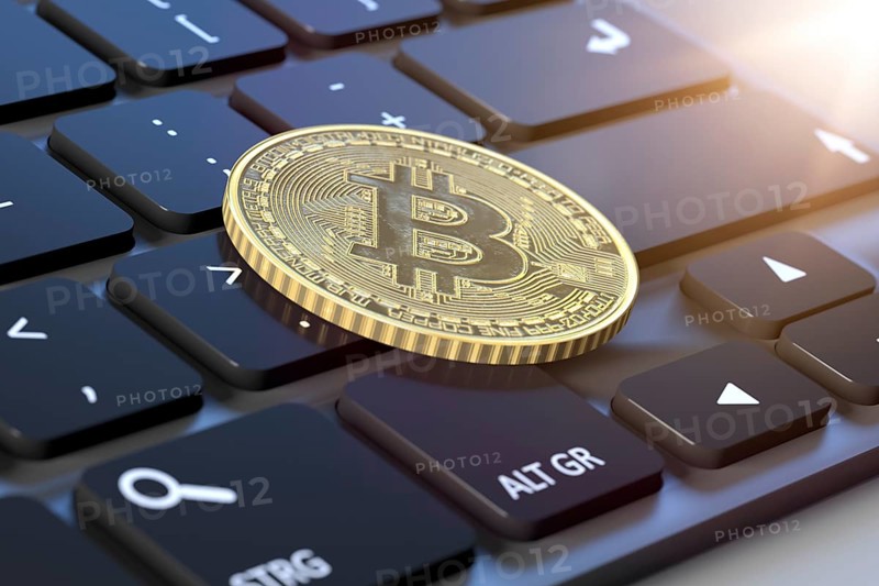 3d rendering of a bitcoin coin on a keyboard