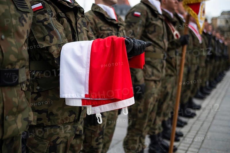 The Polish flag held by a soldier during the ceremony. Poland