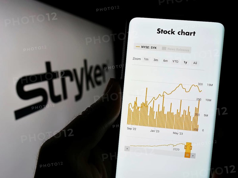 Stuttgart, Germany, 08-09-2023: Person holding cellphone with webpage of US medical technology company Stryker Corporation on screen with logo. Focus on center of phone display, Europe