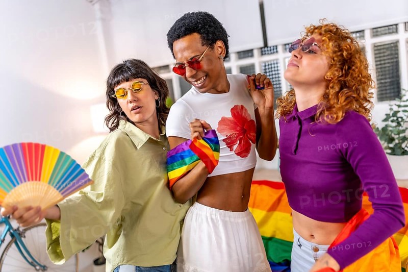 Lgbt multi-ethnic and gender students partying at home celebrating pride