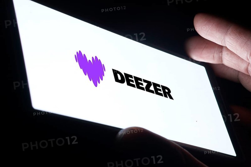 deezer logo is displayed on smartphone. Deezer is a French music streaming service