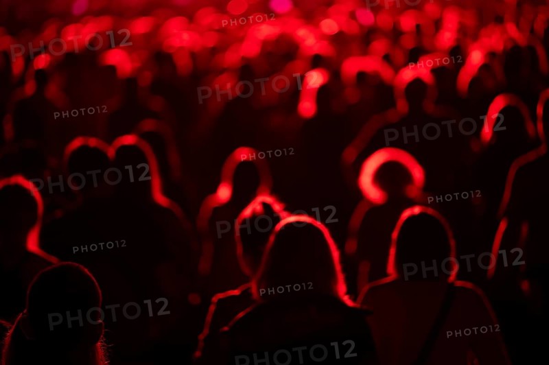 Crowd of people in front of the stage during the concert.