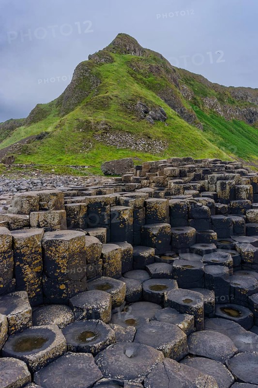 A vertical view of the many volcanic basalt columns of the Giant's Causeway in Northern Ireland