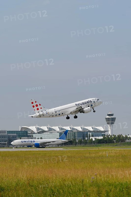 Brussels Airlines A319 taking off on Runway North with United Airlines, control tower and Terminal 2, Munich Airport, Upper Bavaria, Bavaria, Germany, Europe