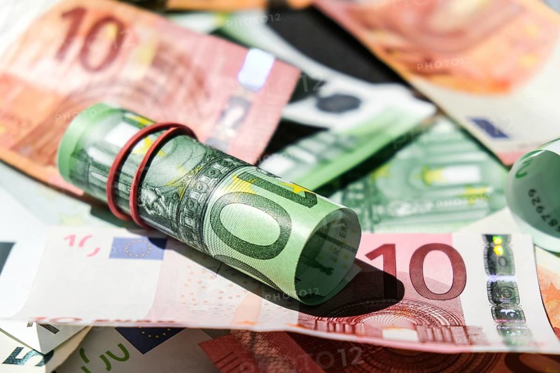 Close up of Euro money roll. Euro banknote set cash money, EU currency. Rolled with rubber euro notes. Business budget of wealth and prosperity finance. Banknotes stacked on each other in different positions