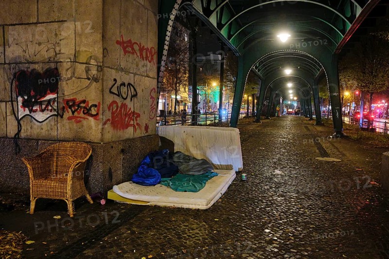 Germany, Berlin, 19.11.2024, Homeless camp under the underground viaduct (Magistratsschirm), Schönhauser Allee, mattresses, armchairs, Europe