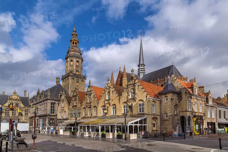 View of main market square with belfry and church in Veurne, Belgium, Europe
