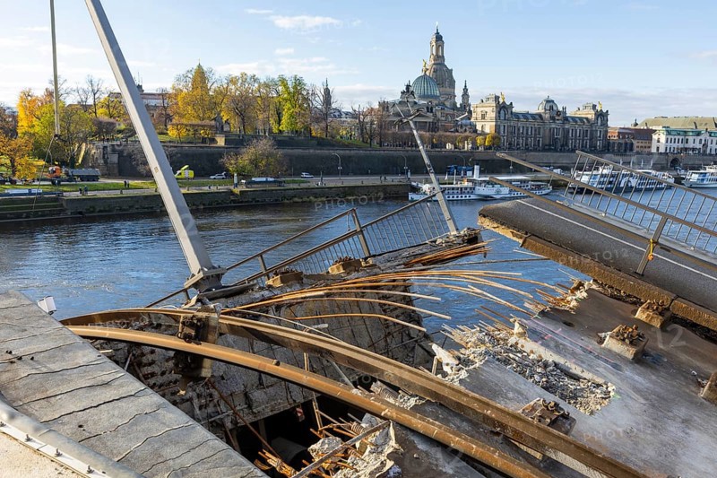 Partial collapse of the Carola Bridge. Over a length of around 100 metres, the section on which the trams normally run has collapsed into the Elbe. The demolition of the section is in full swing. Dresden, Saxony, Germany, Europe