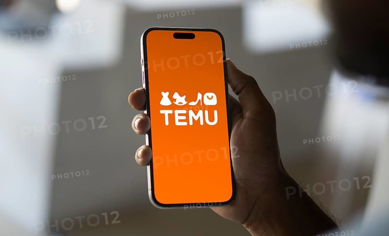 Temu logo online marketplace ecommerce on a smartphone and computer in Stuttgart, Germany.
