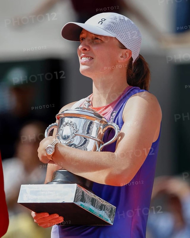 French Open 2024 Champion Iga Swiatek of Poland is holding the trophy at Roland Garros, Paris, France.