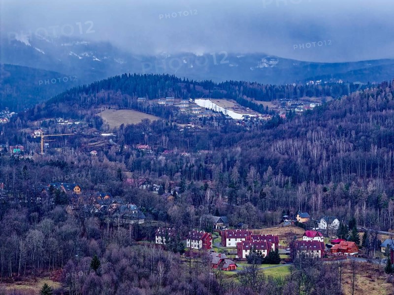 There is artificial snow near Karpacz, Krummhübel, in the lower reaches of the Giant Mountains. The upper layers are in a cloud. Aerial view. Sciegny, Karpacz, Jelenia Gora, Lower Silesia, Poland, Poland, Europe