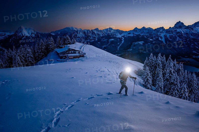 Hiking in the snow in the snow-covered winder landscape in the Alps at Neunerköpfle in the Tannheimer Tal in Tyrol, Austria, Europe