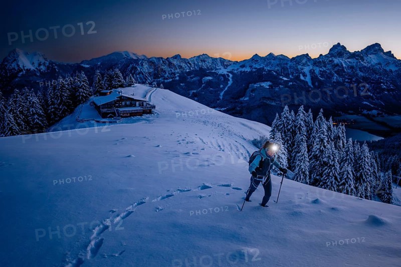 Hiking in the snow in the snow-covered winder landscape in the Alps at Neunerköpfle in the Tannheimer Tal in Tyrol, Austria, Europe