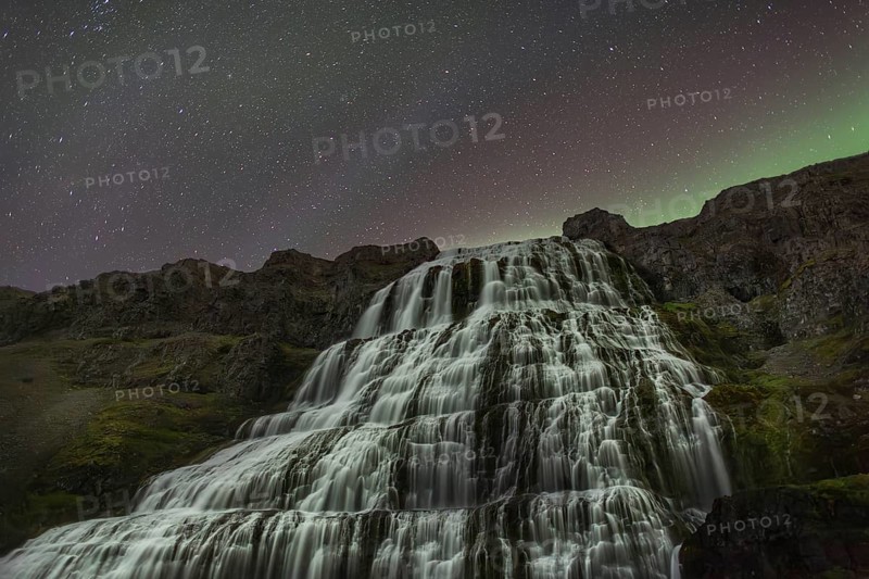 Northern Lights or Aurora Borealis over Dynjandifoss or Fjallfoss, the largest waterfall in the Westfjords, Northwest Iceland, Iceland, Europe