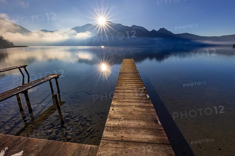 Jetty, boat dock, lake, reflection, fog, sunbeams, backlight, winter, snow, ice, Lake Kochel, view of Herzogstand, Heimgarten, Alpine foothills, Bavaria, Germany, Europe