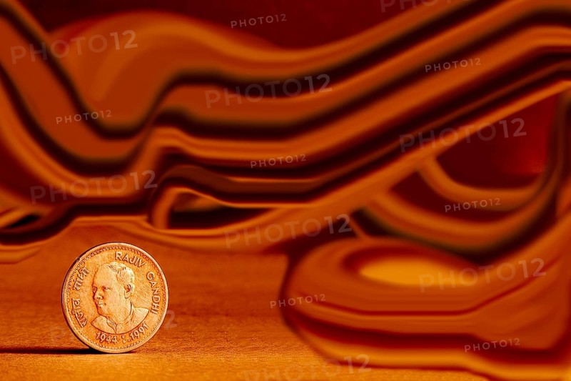 One single Indian currency one rupees coin and artistic background backside embossed Rajiv Gandhi 1944-1991