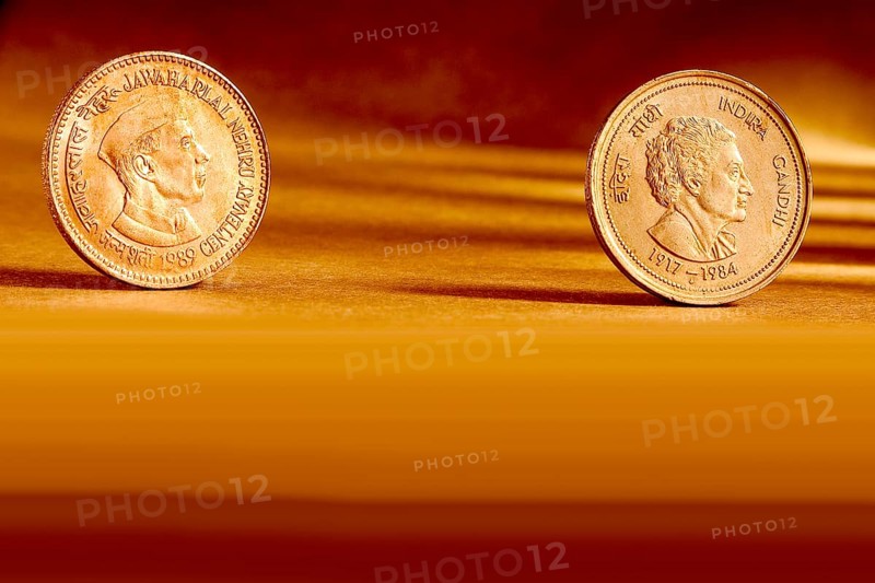 Double pair Indian currency five rupees coin front side and backside manner embossed Jawaharlal Nehru Centenary 1989 & Indira Gandhi 1917-1984 on orange background