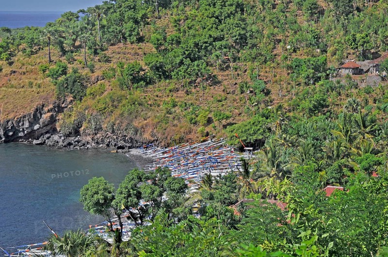 Forested east coast with outrigger boats near Amed, Bali, Indonesia, Asia