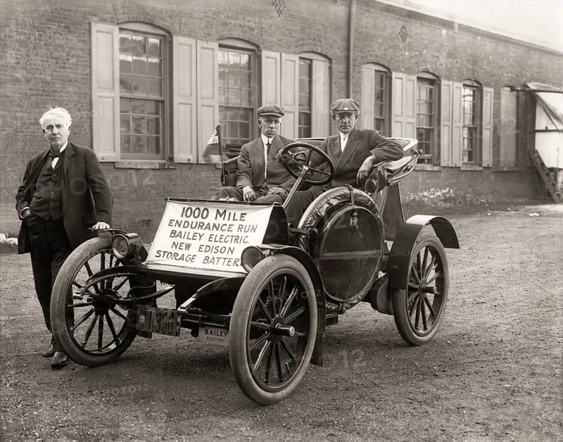 Thomas Edison with his Electric automobile 1910, together with Captain W. Langdon, Bailey Co. test driver and Frank McGuiness, Edison Co. Engineer, 1000 Mile Endurance Run Bailey Electric New Edison Storage Battery, digitally edited
