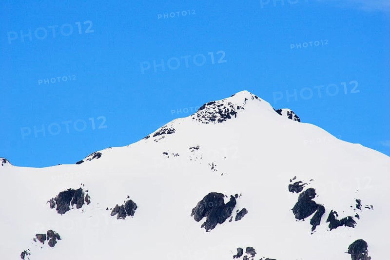 Snow capped mountains, A steel bridge constructed in 1901, tallest cantilever bridge in the world used until 1969, Skagway, Alaska, U.S.A. United States of America