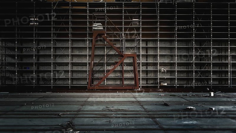 Empty warehouse with large metal shelves in gloomy light, Gerresheimer Germany, Lost Place, Glashütte Gerresheim, Düsseldorf Gerresheim, North Rhine-Westphalia, Germany, Europe
