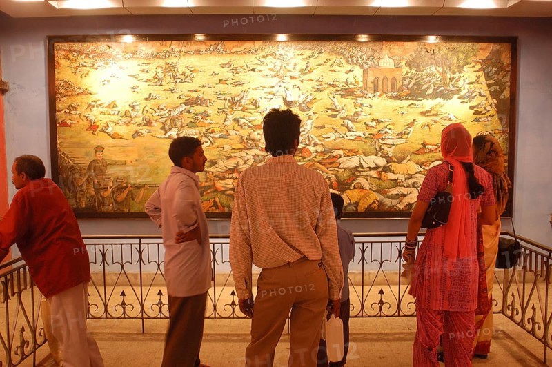 Visitors at the Jallianwala Bagh memorial in Amritsar in Punjab, India have a look at the huge canvas depicting the Jalianwalabaugh Massacre of 1919, This massacre changed the course of India Freedom struggle