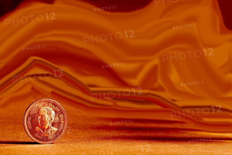 One single Indian currency one rupees coin and artistic background backside embossed Rajiv Gandhi 1944-1991