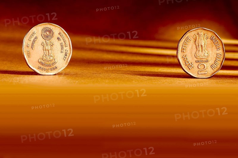 Double pair Indian currency two rupees coin front side and backside manner embossed supreme Court of India 1950-2000 on orange background