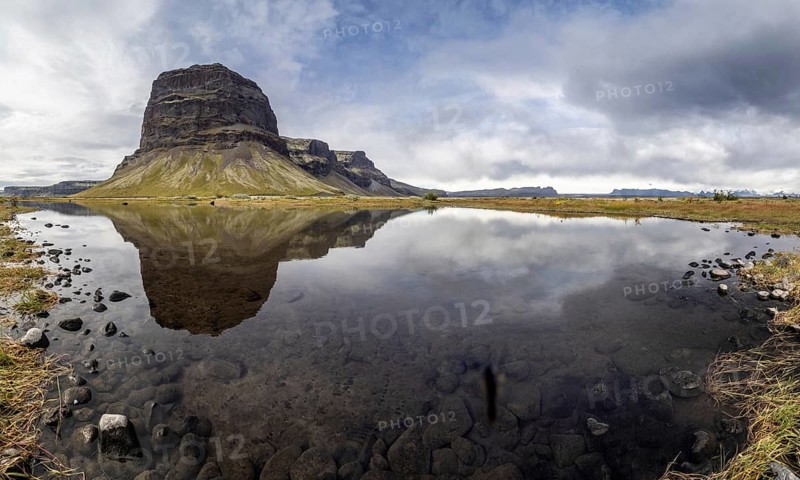 Rock massif Lomagnupur or Lómagnúpur, reflection in a pond, panoramic photo, South Iceland, Iceland, Europe